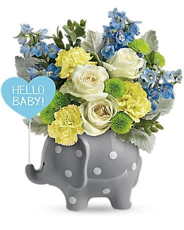 Bouquet in a gray elephant vase with a blue "Hello Baby!" sign