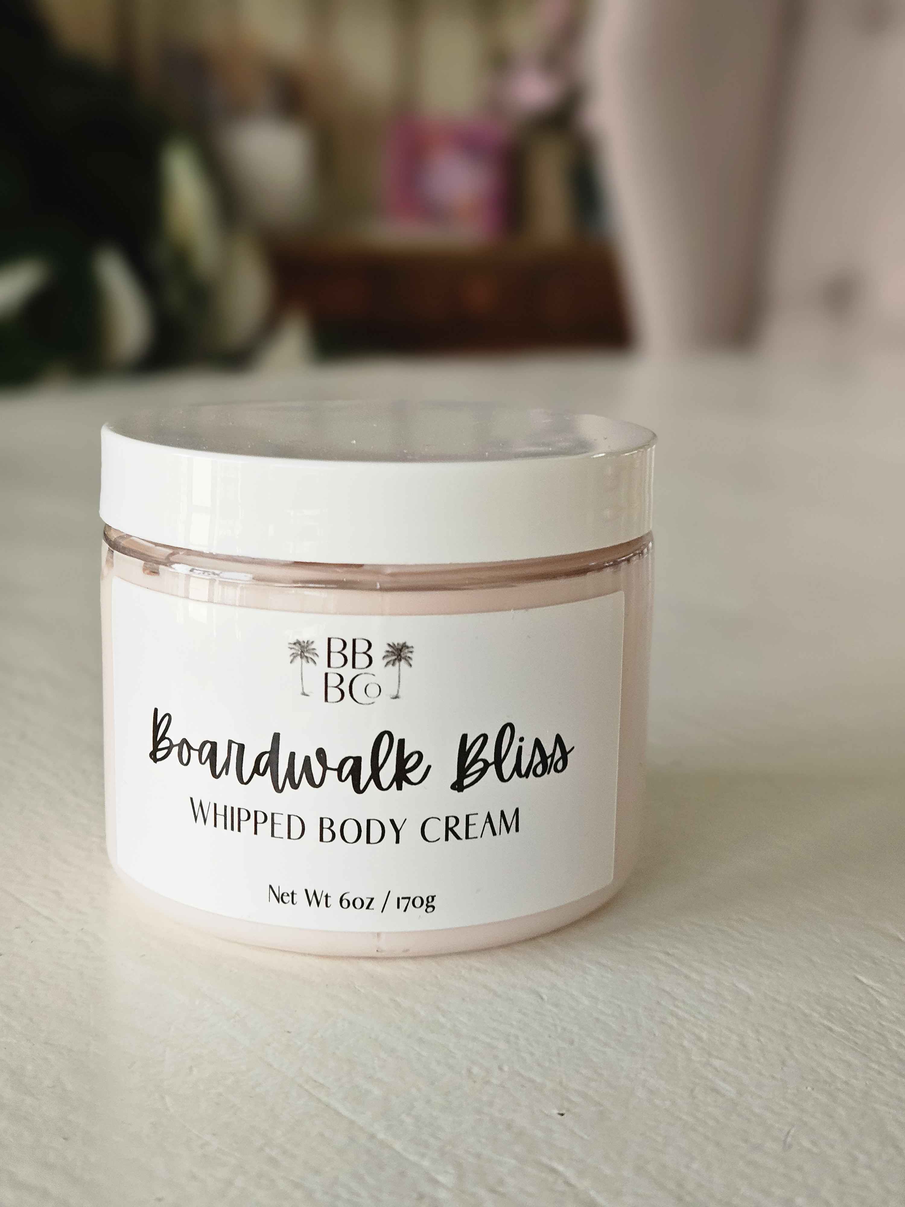 Boardwalk Bliss Whipped Body Cream - Take a stroll down memory lane with Boardwalk Bliss Whipped Body Cream—a dreamy, lotion that smells like sunshine and sweet treats by the sea. This whimsical vanilla scent blends fluffy cotton candy, candied apple, buttery popcorn, warm vanilla bean, and a kiss of caramelized amber. It’s like your favorite day at the boardwalk... bottled.