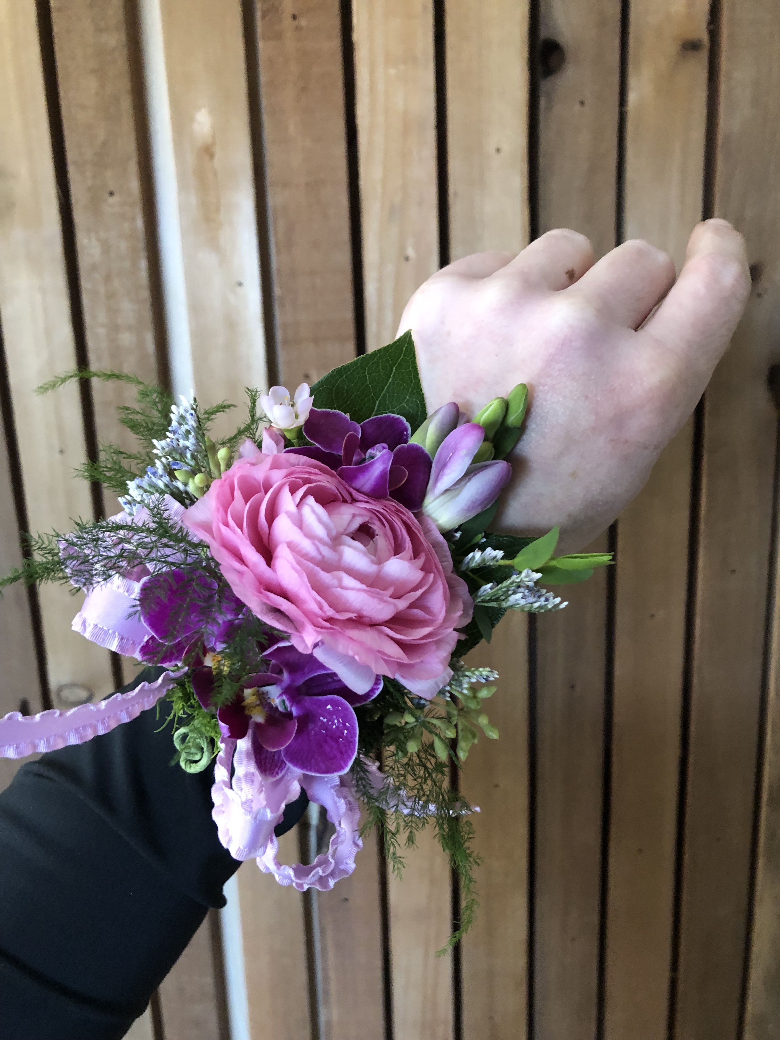Custom Corsage - Our corsages are thoughtfully designed to complement your look, with multiple styles available as shown in the photos. For the most personalized result, we recommend calling the shop directly so we can ensure every detail is just right.  If you prefer to place your order online, please include the following information at checkout: the color of the dress and any accent colors you would like incorporated into the ribbon and floral design. This allows us to create a corsage that coordinates beautifully with your overall style.  Each piece is carefully crafted with attention to color, balance, and finish to ensure an elegant and cohesive final look.