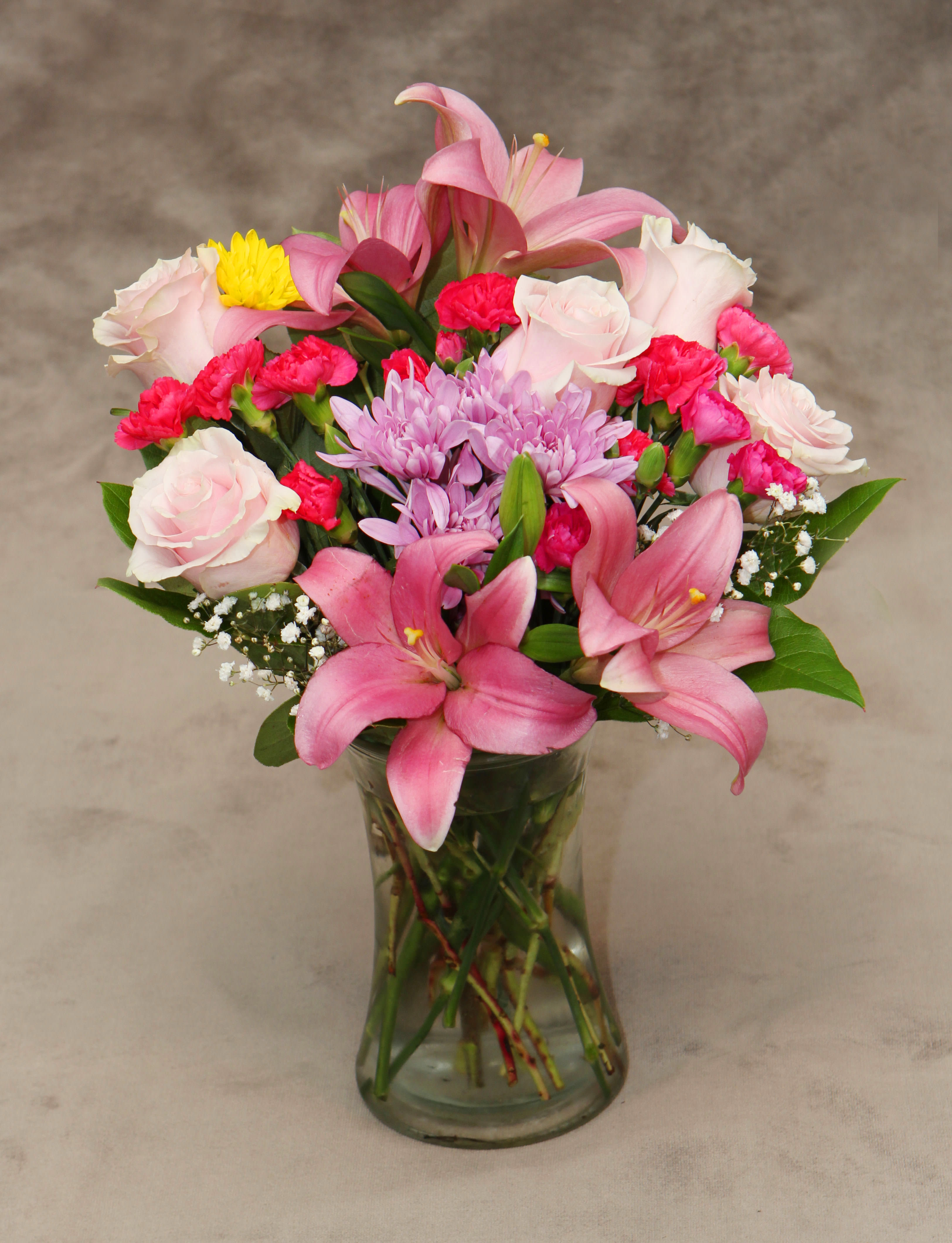 Sweet Honesty - Pink asiatic lilies, light pink Roses , hot pink mini Carnations , lavender cushion Mum, baby's breath, and fresh greens.