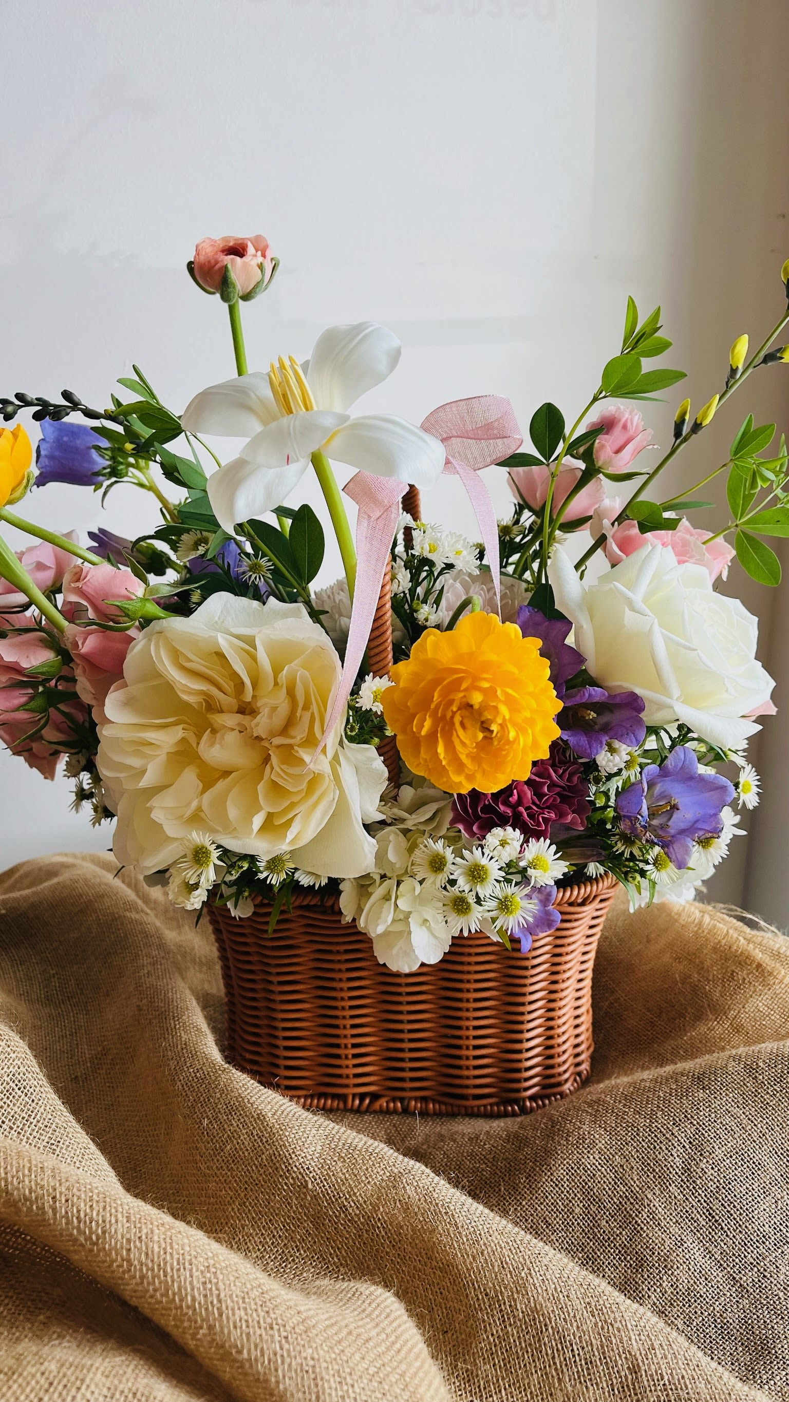 Mother's Day Baskets - An upscale Mother’s Day flower basket filled with locally grown blooms in soft, elegant tones. Lush and garden-inspired, each basket is uniquely designed—just what she deserves, and almost as beautiful as Mom.