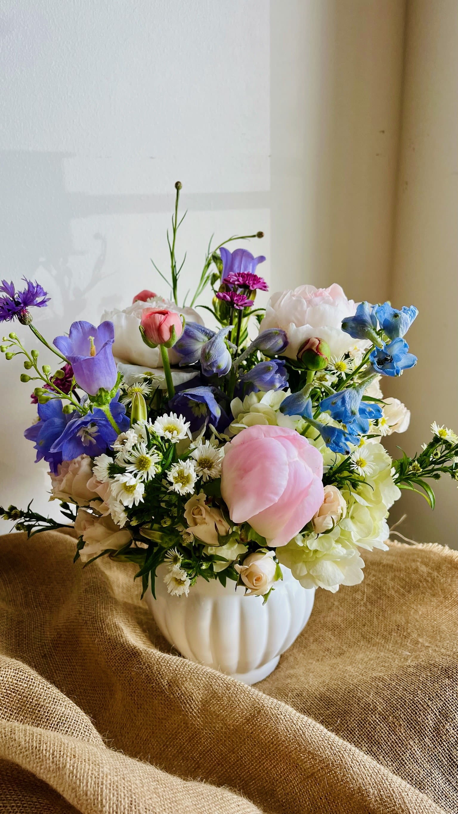 Mother's Day Vase Arrangement - A soft, garden-style Mother’s Day vase arrangement with locally grown blooms in romantic pastel tones. Fresh, seasonal flowers are artfully arranged in a vase—an elegant, ready-to-enjoy gift perfect for celebrating Mom.
