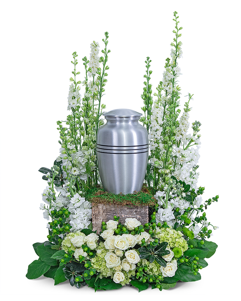 White floral funeral urn arrangement with a silver urn centerpiece