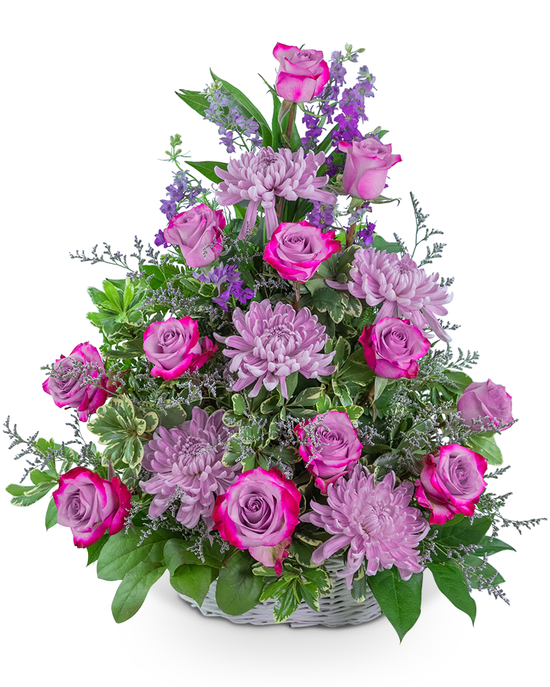 Pink roses and lavender chrysanthemums in a white basket