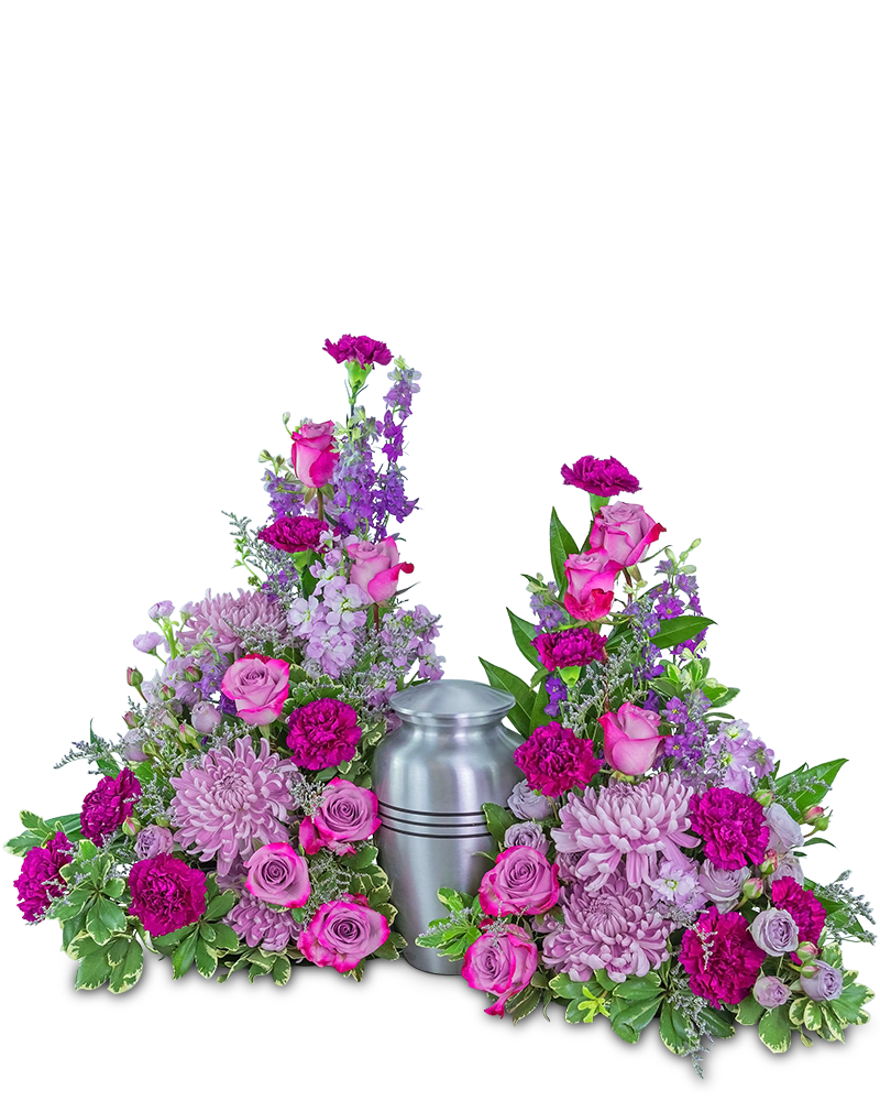 Two pink and purple floral arrangements flank a silver urn.