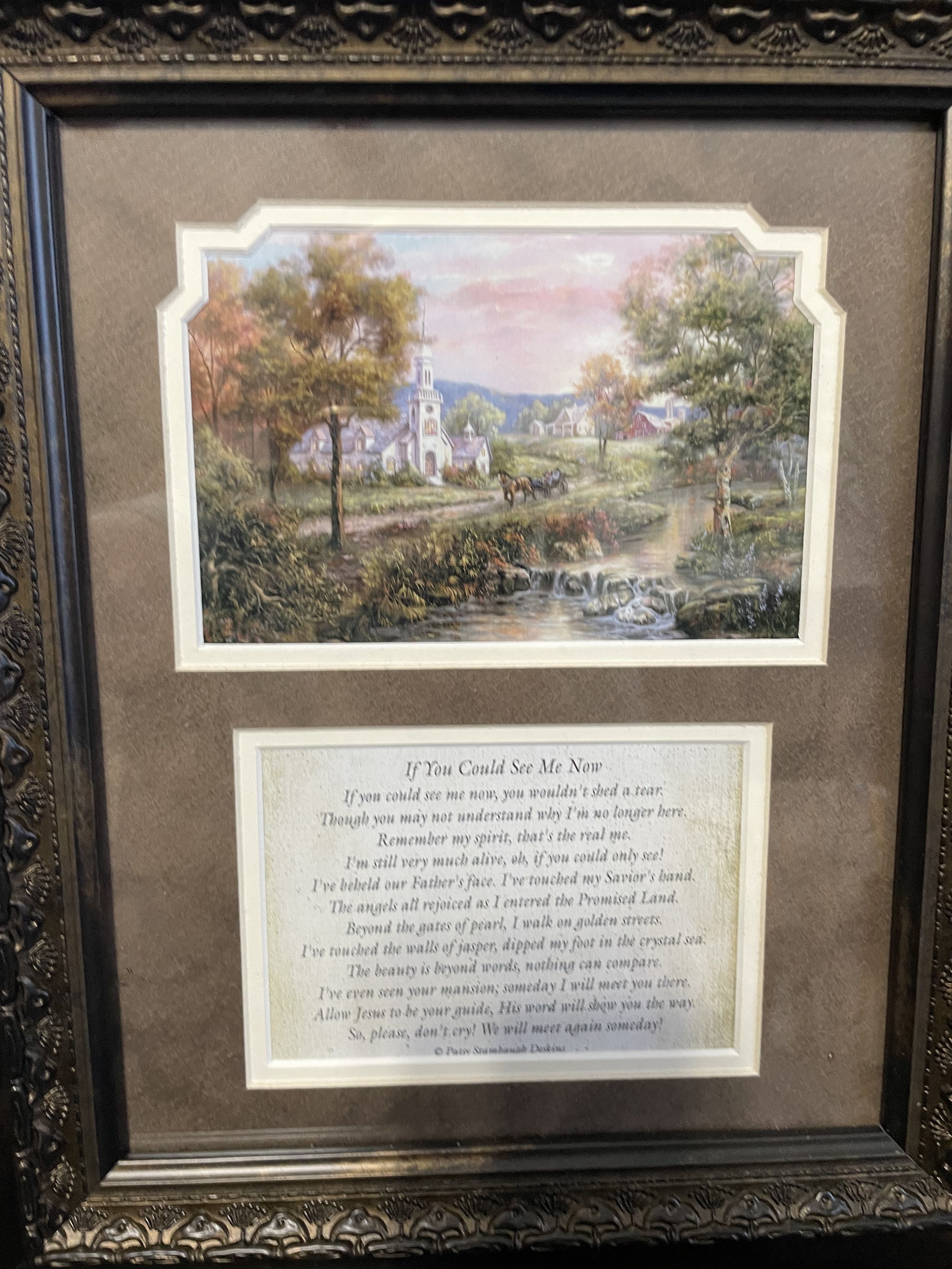 Framed landscape print above a memorial poem plaque
