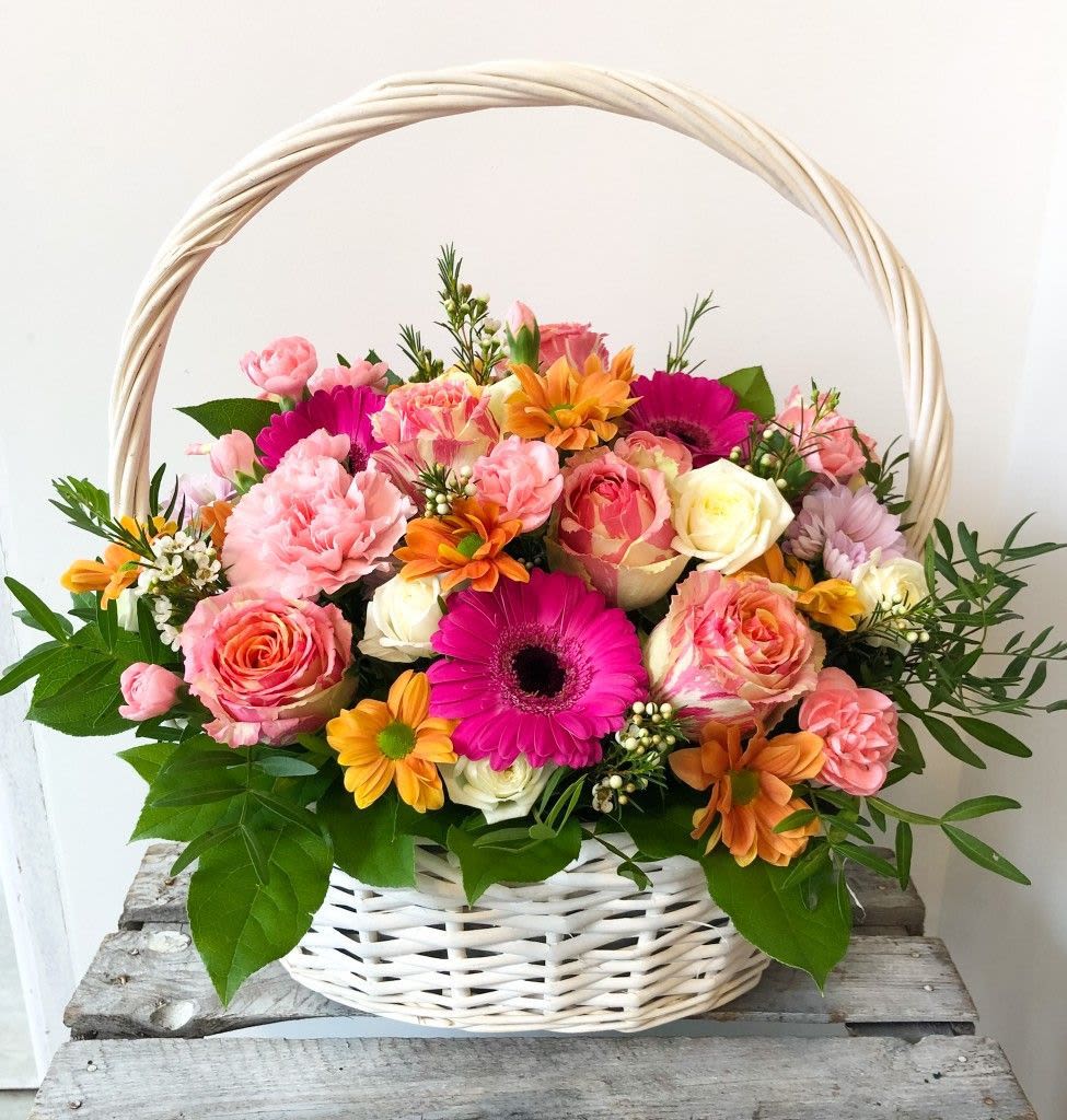 Wicked Mixed Flower Basket – Seasonal Bloom Gift Arrangement - A Wicked-style floral basket featuring a fresh seasonal mix of blooms. Each arrangement is uniquely designed using available flowers in-store, such as roses, carnations, gerberas, and daisies in soft or vibrant colors.  Perfect for Mother’s Day, home décor, or any special occasion. Every basket is one of a kind, while always staying fresh, full, and beautifully arranged.