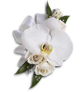 White orchid and rose corsage with green leaves and pearl accents