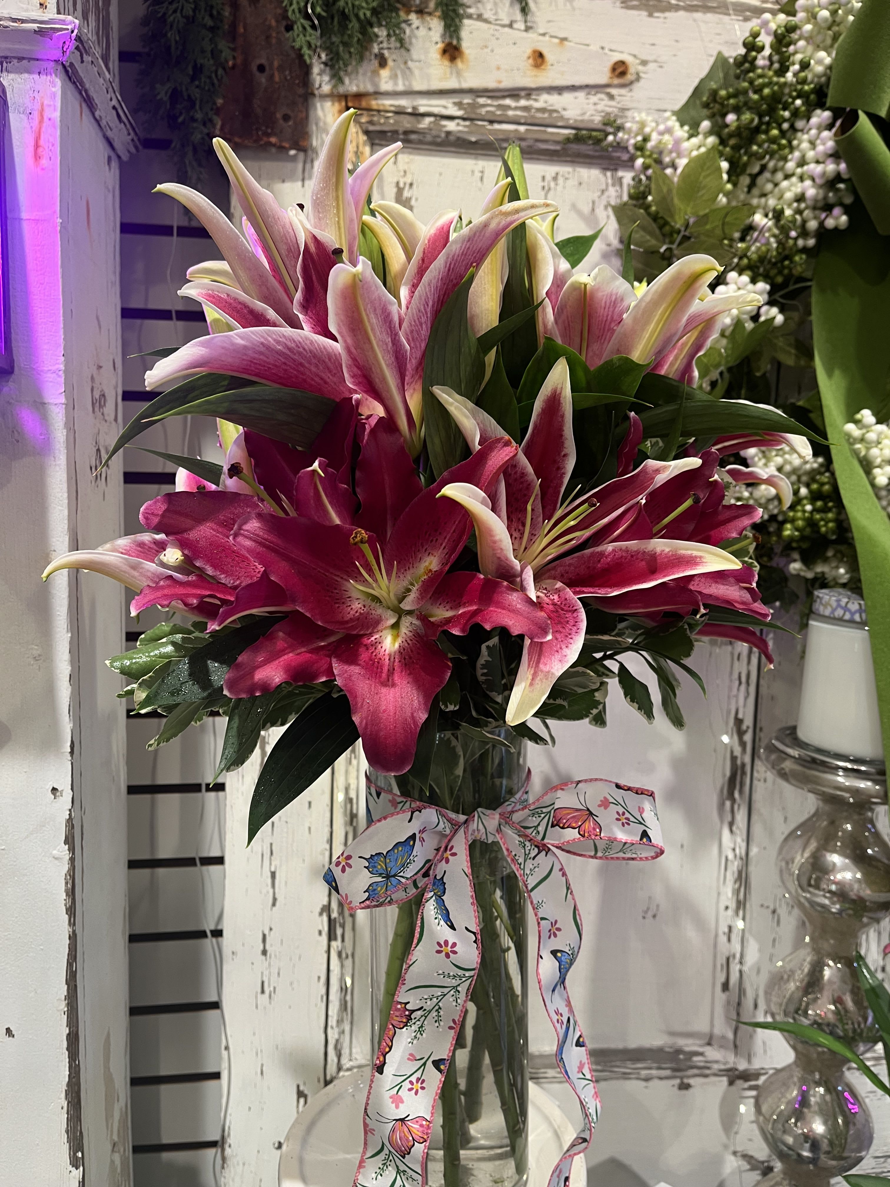 Stargazing - Locally grown Sorbone Lillies arranged in a clear vase.