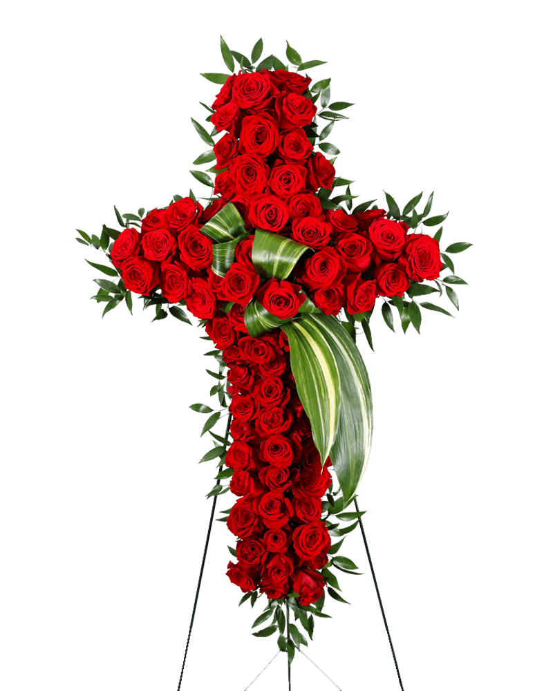 Cross-shaped arrangement of red roses with green foliage