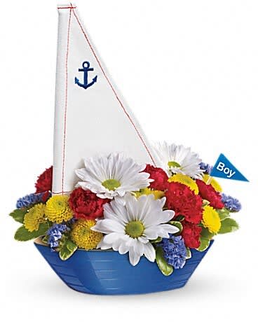 Blue sailboat-shaped flower arrangement with white daisies and colorful blooms