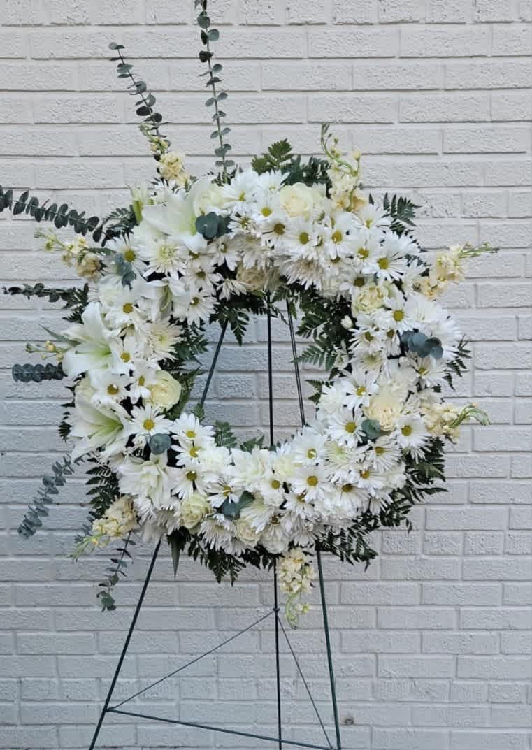 Standing Wreath #1 - it is made with: 10daisies 10white pompoms 8 white roses 2 white lilies greens 8 white stock eucalyptus 