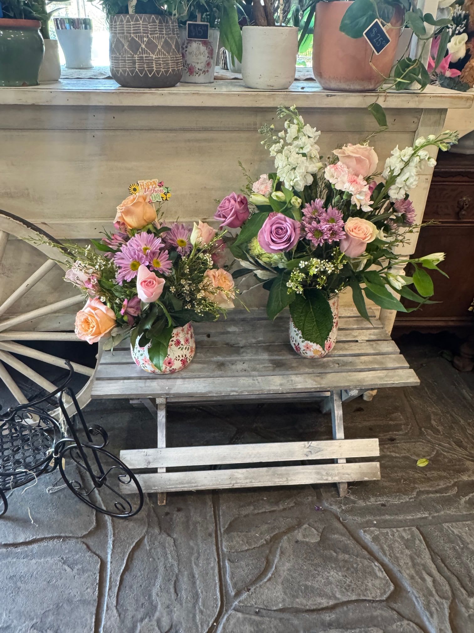 Mothers day - A Soft, garden-fresh pastels make this Mother's Day flower arrangement feel like a gentle spring morning-perfect as a Mother's Day bouquet or a sweet birthday surprise. The loose, hand-arranged style in small floral-print ceramic vases gives the recipient an immediate sense of warmth and thoughtfulness; she'll feel truly seen by the delicate mix of pinks, purples, whites, and peach tones.  This arrangement combines roses, chrysanthemum daisies, carnations, snapdragons and complementary blooms for a layered, textural look. Tall white spikes add height and airy movement while the blush and lavender roses bring soft focal points; each duo of ceramic vases comes with a floral pick for secure styling. The compact, garden-style composition fits on a bedside table, kitchen island, or desk and reads as both casual and refined.  Ideal for moms who love a romantic, cottage-garden vibe, it's a meaningful way to say "thinking of you" for Mother's Day, birthdays, or spring celebrations. Care is simple-place in fresh water, trim stems every few days, and keep out of direct heat to extend vase life.