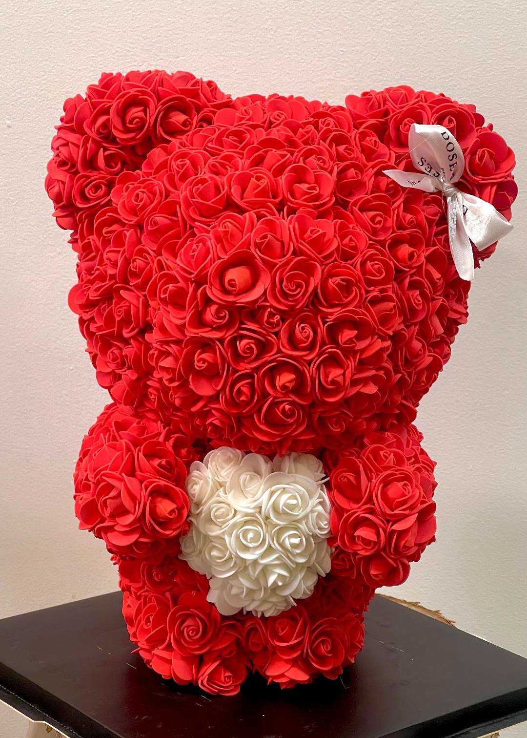 Red Teddy Bear with Gift box - Red teddy bear rose bouquet.  colors: Red.  _Crafted with premium red faux roses. _16"/11" Teddy bear adorned with a black ribbon. _Comes in a custom acrylic box for a lasting impression.  Perfect for Valentines Day, Birthday, Mother's Day &amp; Anniversaries 