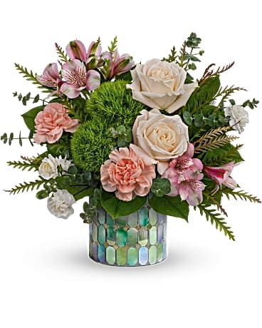 Bouquet of cream roses and pink alstroemeria in a mosaic vase