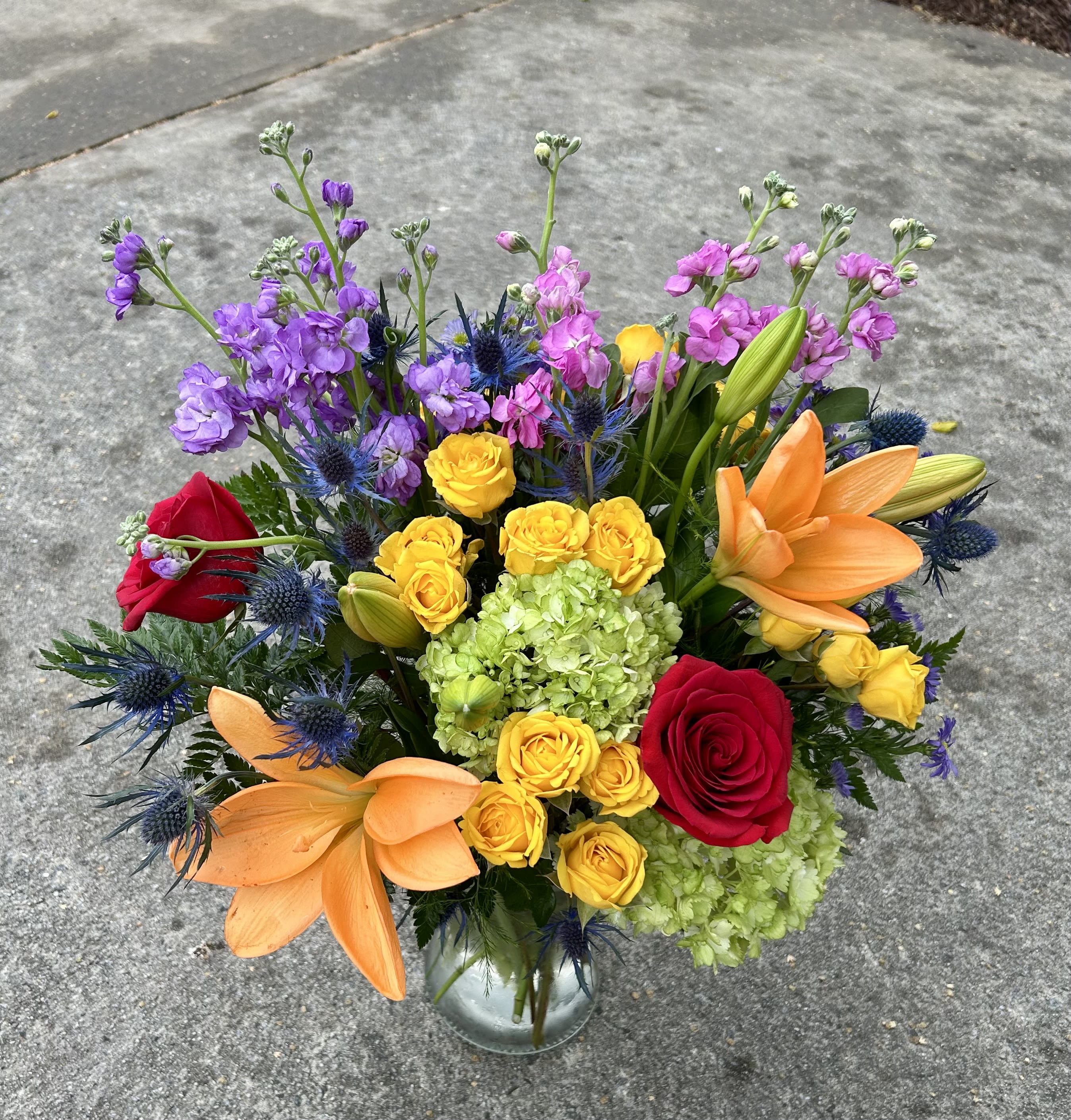 Color Carnival - Playful and eye-catching, this arrangement mixes vivid hues and unique textures for a fun, festive feel.