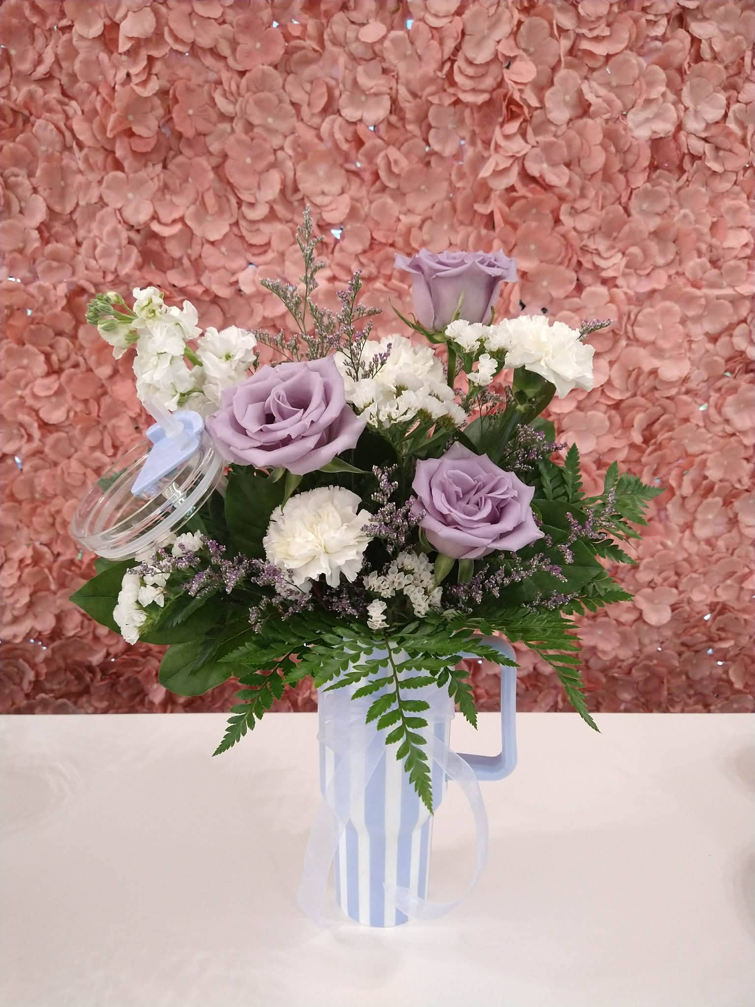 Mother's Day Tumbler - An assortment of florals in a sturdy tumbler with a lid and straw. Colors vary, but you can request specifics in special instructions.