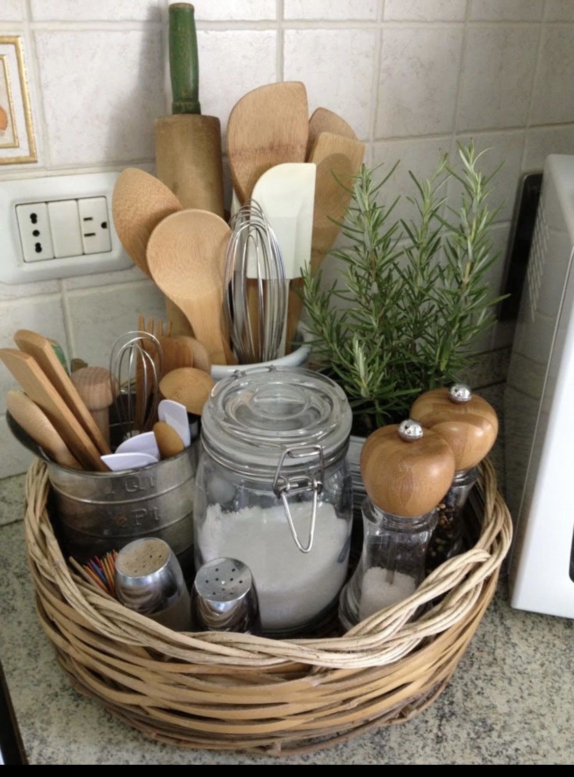 Chefs kiss Basket - A charming kitchen countertop caddy that makes a thoughtful housewarming gift or hostess present, this Chefs kiss Basket pairs everyday usefulness with rustic, decorative appeal. The arrangement reads like a practical centerpiece for a busy cook - perfect for a new home, a thank-you for someone who loves to cook, or as a styled accent for a kitchen refresh.  Nestled in a woven basket, the set includes wooden spoons, wooden spatulas, a whisk, a glass jar, salt and pepper shakers, and a small herb plant that brings a fresh green pop against the warm brown wicker and wood tones. A ceramic utensil holder keeps tools tidy and the compact composition fits neatly on most countertops; the natural textures and neutral palette - brown, green, white, and black - blend easily with farmhouse, rustic, or modern kitchens.  Give this to the person who cooks from the heart and wants their workspace to feel cared for; it's the kind of gift that makes someone feel seen and ready to create. The basket arrives ready to display with sturdy hard goods that are both decorative and usable - no assembly required.