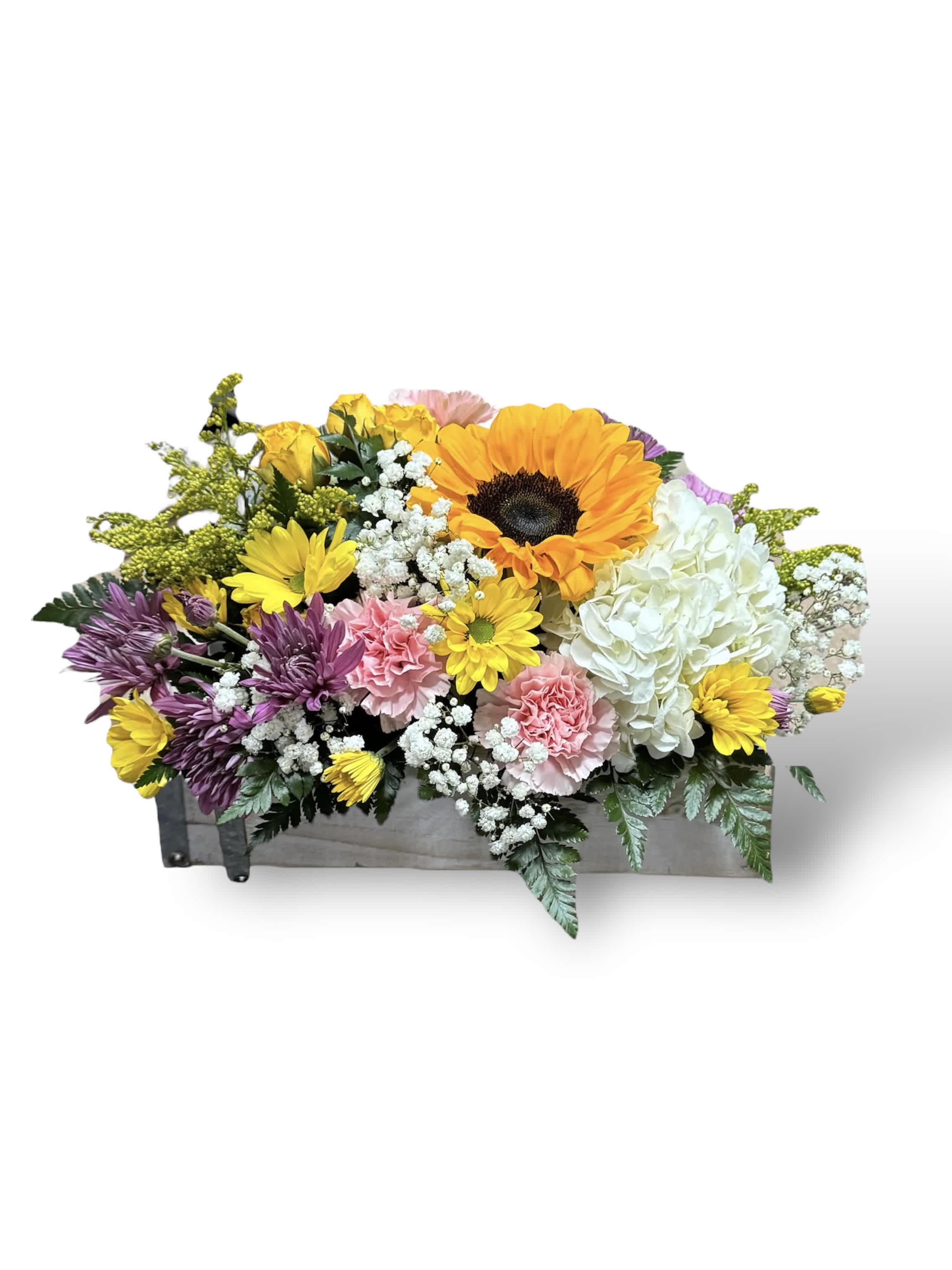 Mixed bouquet in a wooden box with sunflowers, roses, hydrangea, and daisies