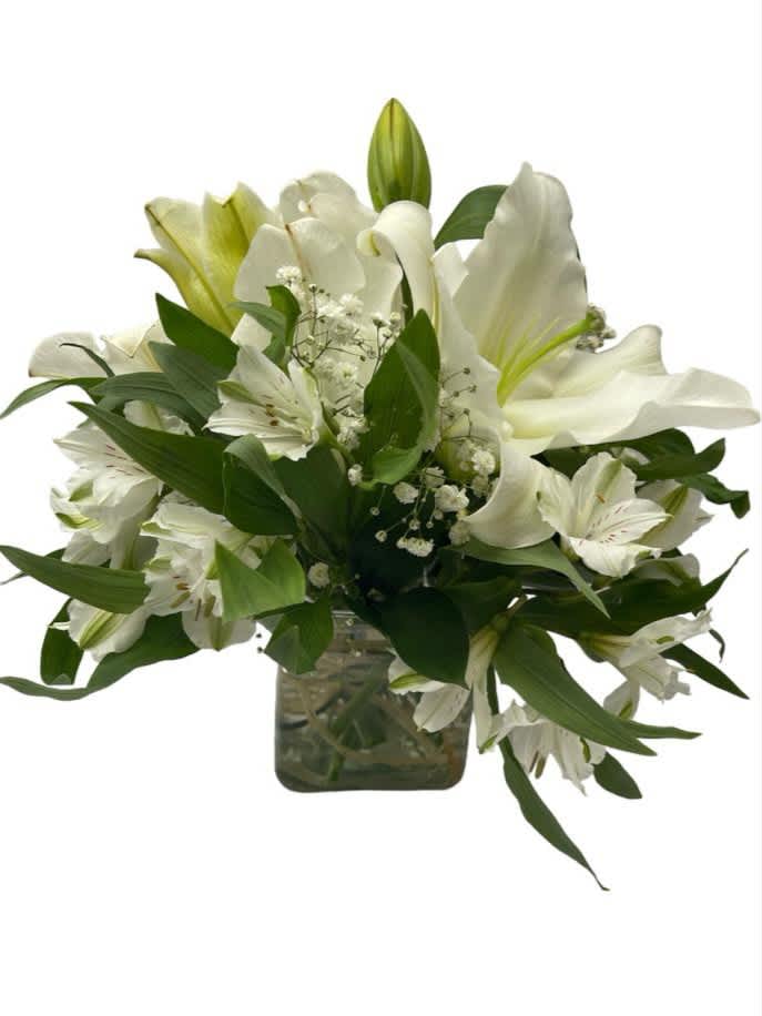 White lilies and alstroemeria in a glass vase