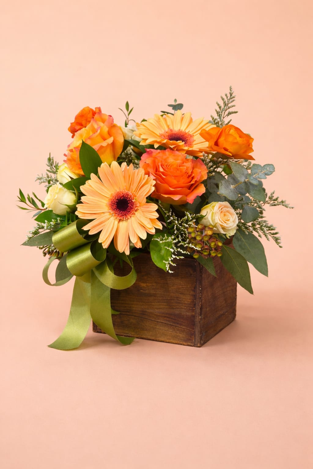 Golden Peach Garden Box – Designer’s Choice | Mother’s Day Special - Our Golden Peach Garden Box is designed with a vibrant mix of peach, yellow, and orange tones, creating a cheerful, sunshine-filled arrangement that instantly brightens any space.  This Designer’s Choice arrangement will be crafted using fresh, premium flowers in this warm color palette, maintaining the same size, shape, and overall look while allowing for seasonal substitutions.  Arranged in our rustic wooden box, this is the perfect option for moms who love bright, happy colors and bold floral designs—all at a special value price point.   Color palette: Peach, yellow, orange  Style: Bright, cheerful, eye-catching  Price point: Special value design (~$75)  Best for: “She loves bold, sunny colors”