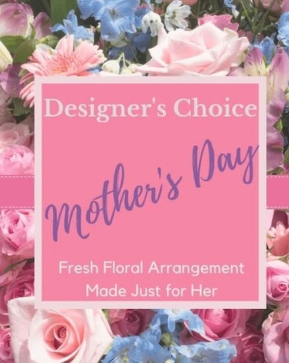 Pink floral arrangement with a Mother's Day sign