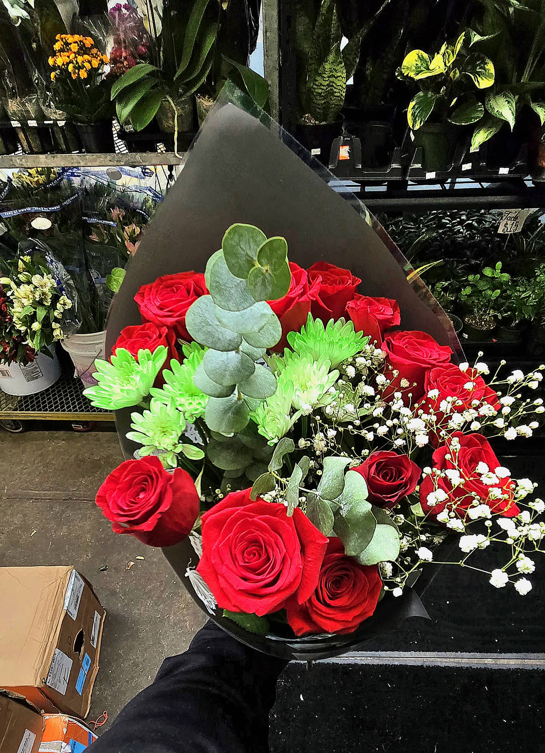Bouquet of red roses with green chrysanthemums and white baby's breath