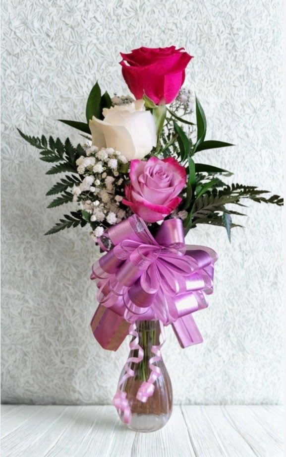 Triple Bloom Elegance - Three beautiful roses arranged in a vase with baby's breath and a coordinating bow. Rose and bow colors may vary based on availability, but each arrangement is thoughtfully crafted and full of charm