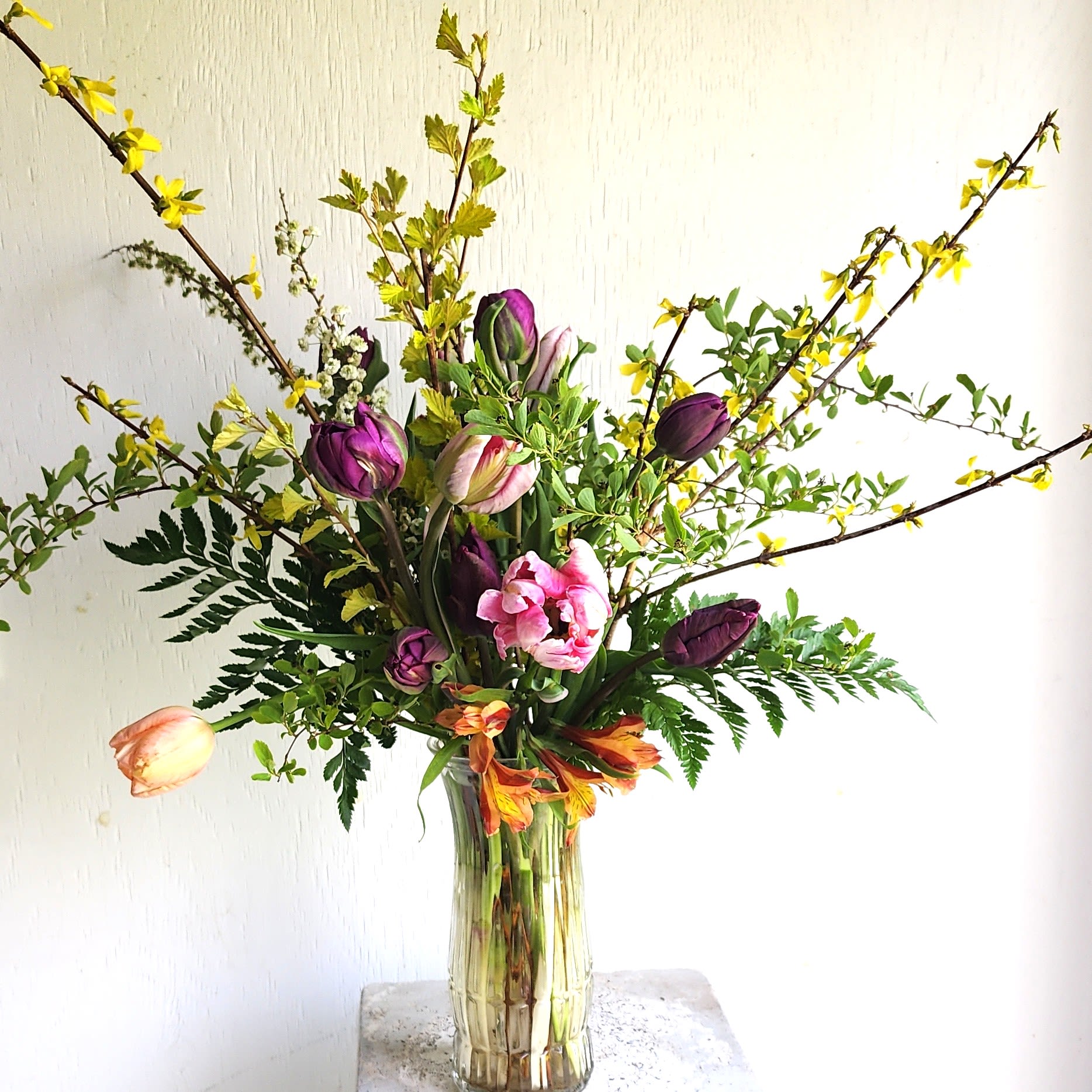 Purple Passion   - We are a small studio florist in a small town. Every bouquet we create is a one-of-a-kind creation, tailored to the season, availability of flowers, color choice, artistic interpretation, and the current materials available. The photos do not represent the exact flowers that will be delivered. They are intended to provide you with an idea of  the variance that can be expected.  The season, availability of flowers, interpretation, and the current materials available.  