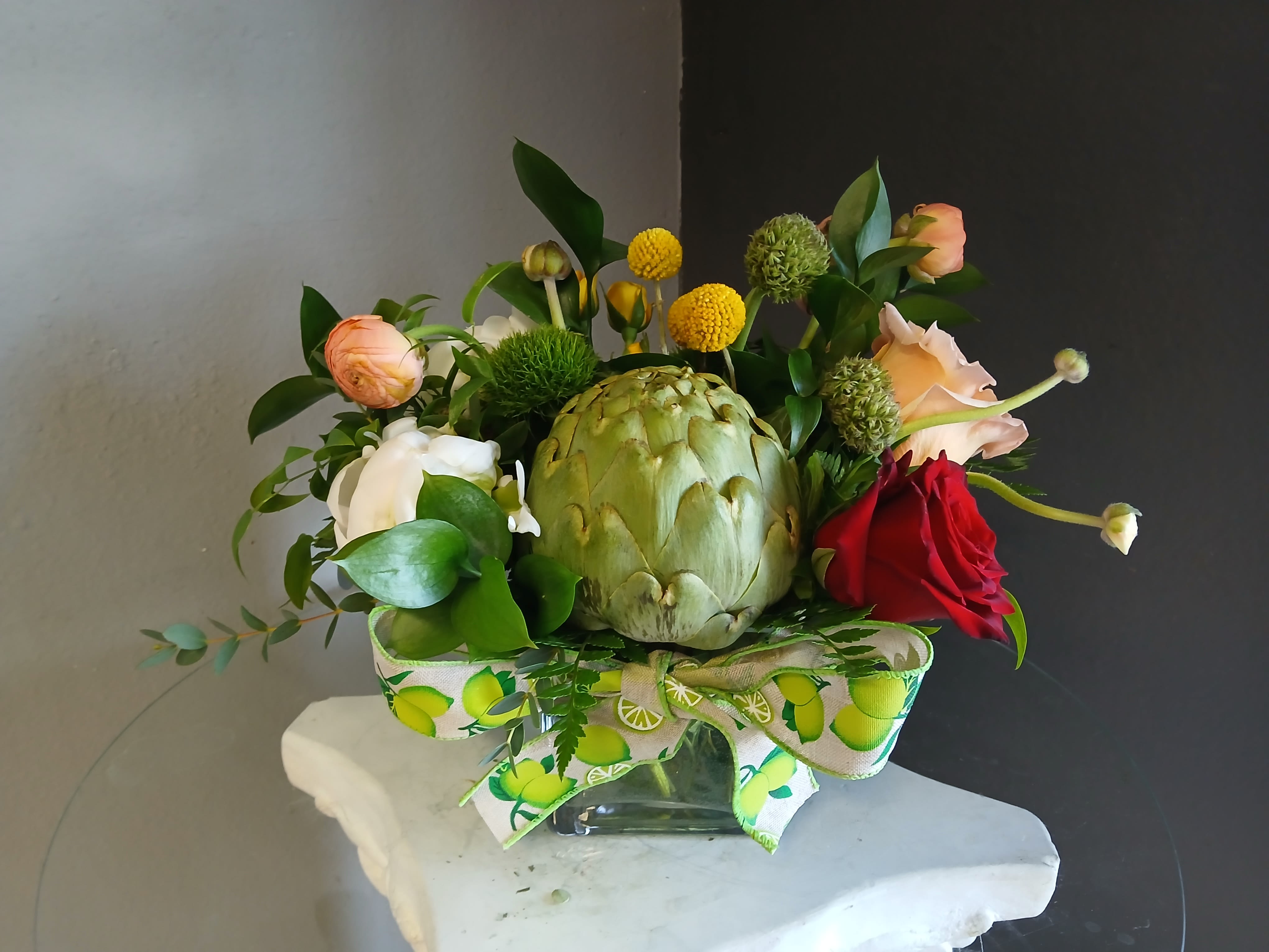 #750 Designer's Choice Vase Arrangement - This beautiful flower arrangement of fresh mixed seasonal blooms is made by local designers in the heart of Orange California. Hand crafted and perfect for every occasion, from birthdays and new babies to sympathy and just because. The best choice to show you are thinking of that special someone. Can be sent as a local delivery or in-store pickup. This is an original, one of a kind arrangement. Order now before it's too late!  UPGRADES: All upgrades are applied at the designer’s discretion and fulfilled to value using the freshest seasonal and/or premium flowers available. Container upgrades may be included when possible; otherwise, value is reflected in the floral selection while maintaining the original design style.