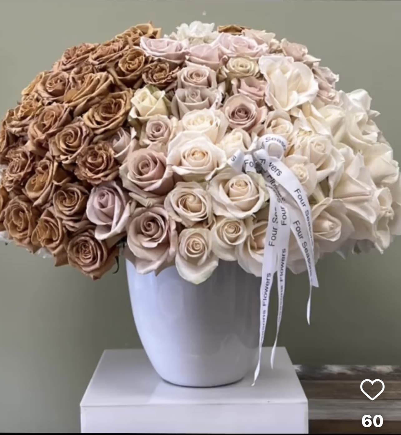 Large bouquet of roses in a white vase