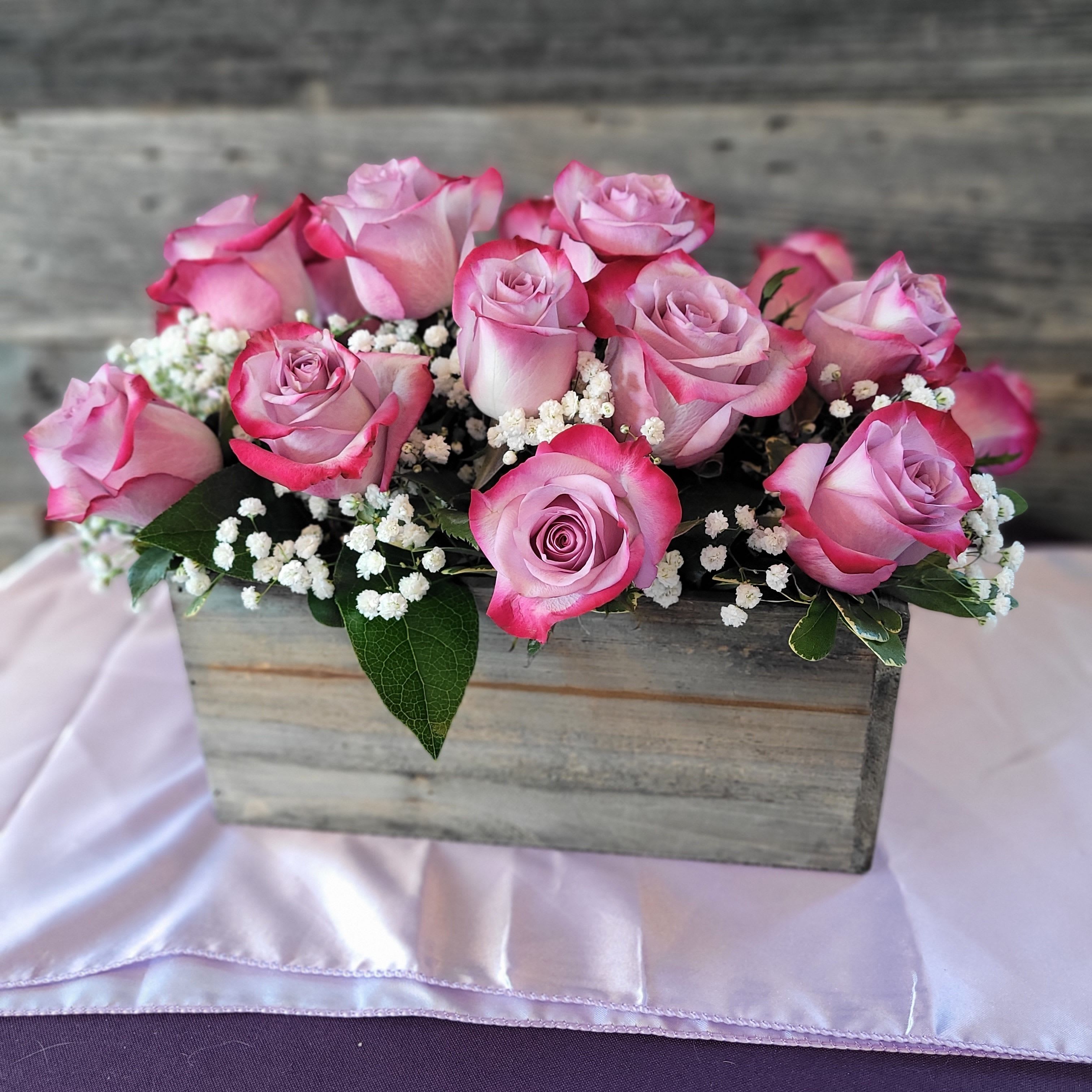 A Box of Roses - Lovely roses in a rectangular box with filler flowers and greenery. A contemporary twist on a classic design. 