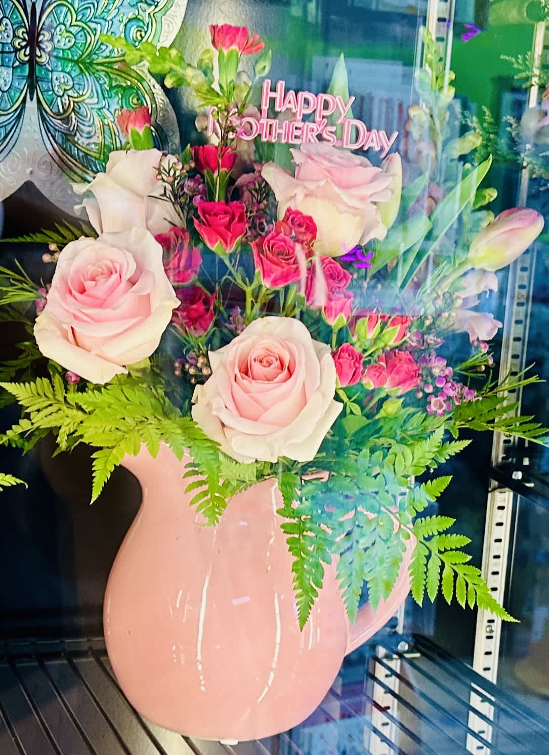 The Simply Celebrated - Make Mother’s Day extra special with our Upgraded Designer’s Choice Arrangement* beautifully styled in a color vase.  *Style/Color Varies From Photo
