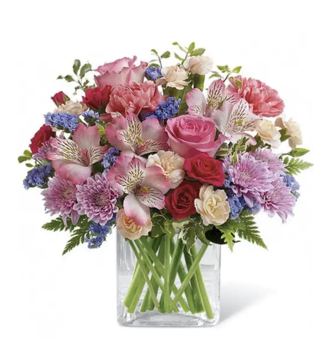 Mixed pink and purple bouquet in a clear glass vase