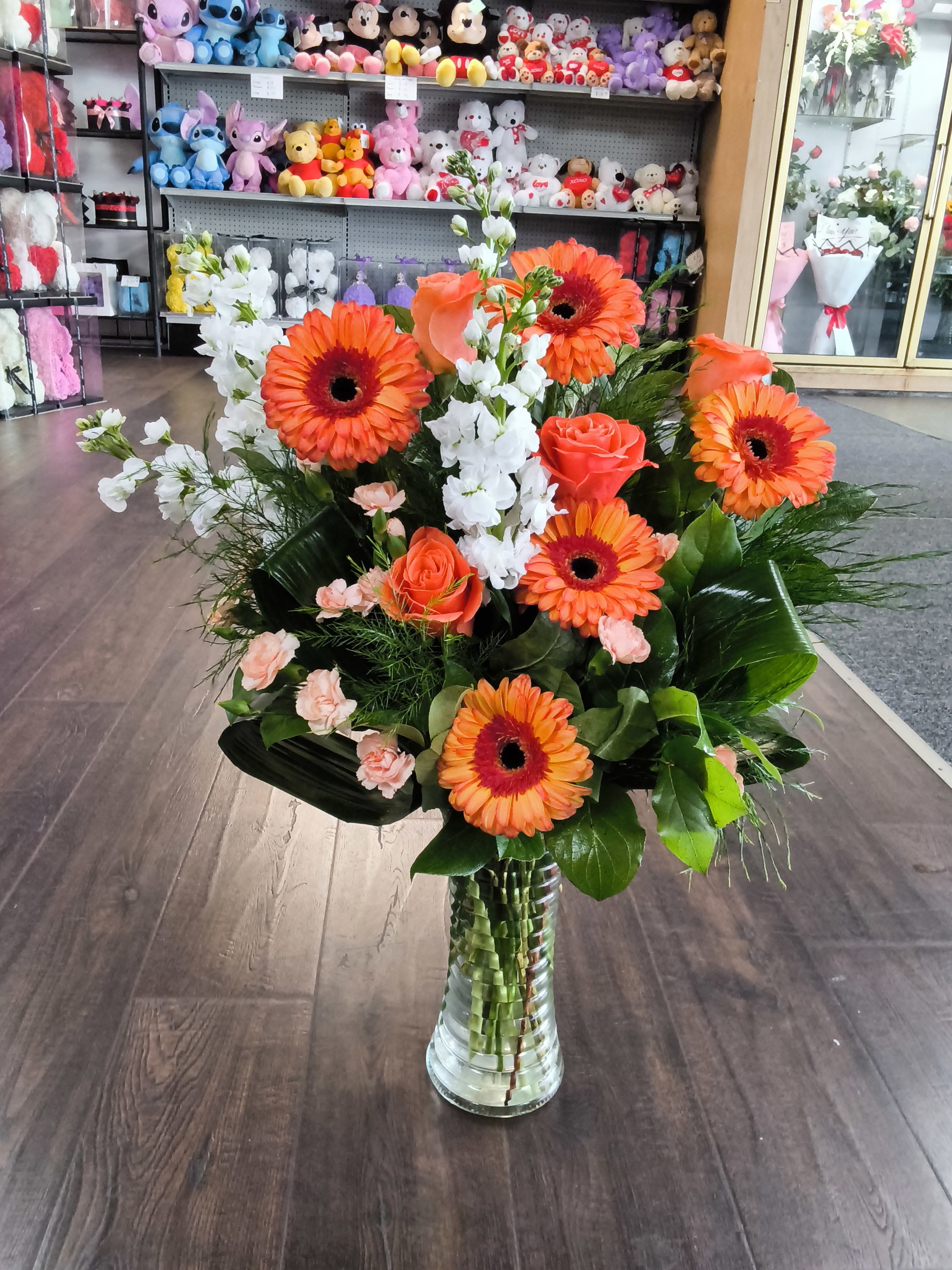 Creamsicle - Creamsicle by BloomNation™ is a sweet peachy orange explosion! Make a good day perfect by sending this beautiful mono-colored arrangement. A great gift option for autumn celebrations or birthdays.  Approximate Dimensions: 16"D x 22"H