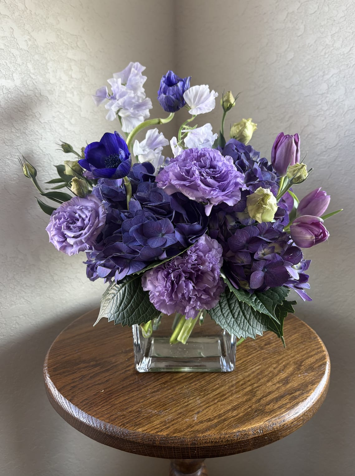 Your Aura is Purple - There’s a moment where everything softens… the light, the music, the feeling in your chest. This arrangement lives right there. Layered with dreamy blooms and grounded textures, it feels like stepping out of the noise and into something deeper.