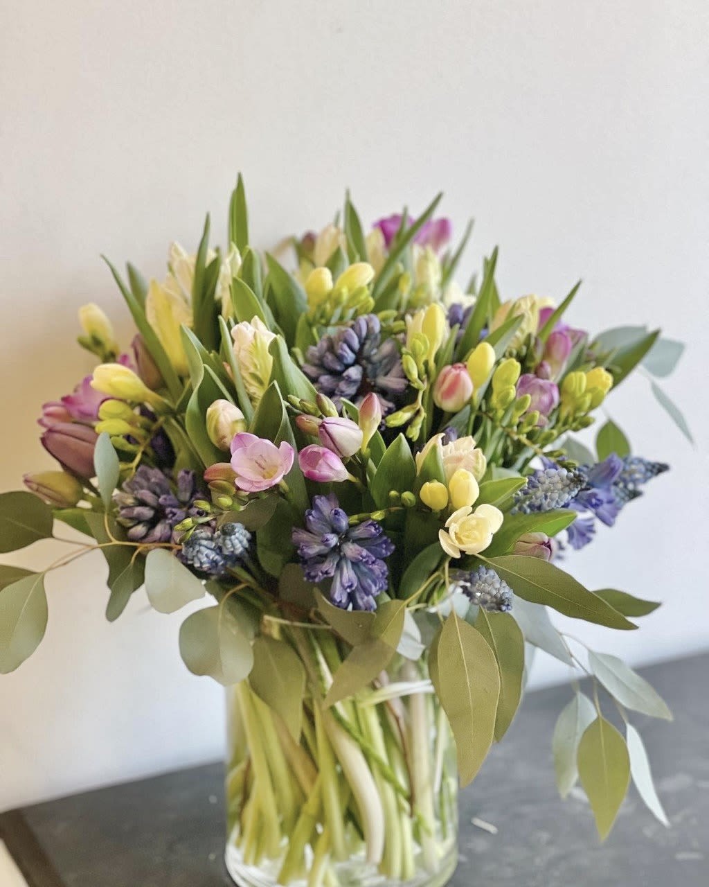 Mixed pastel bouquet in a clear glass vase
