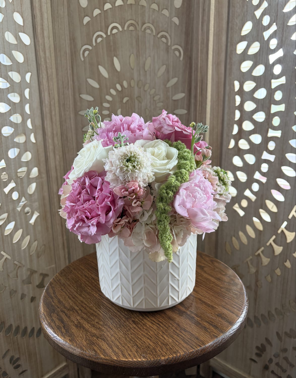 Blush Babe - Soft, full, and effortlessly pretty this design is all about romance in bloom.Designed in a cream chevron pot, this arrangement feels polished yet sweet like a love note in floral form. Round, full, and unapologetically feminine… made for the ones who love pretty things.