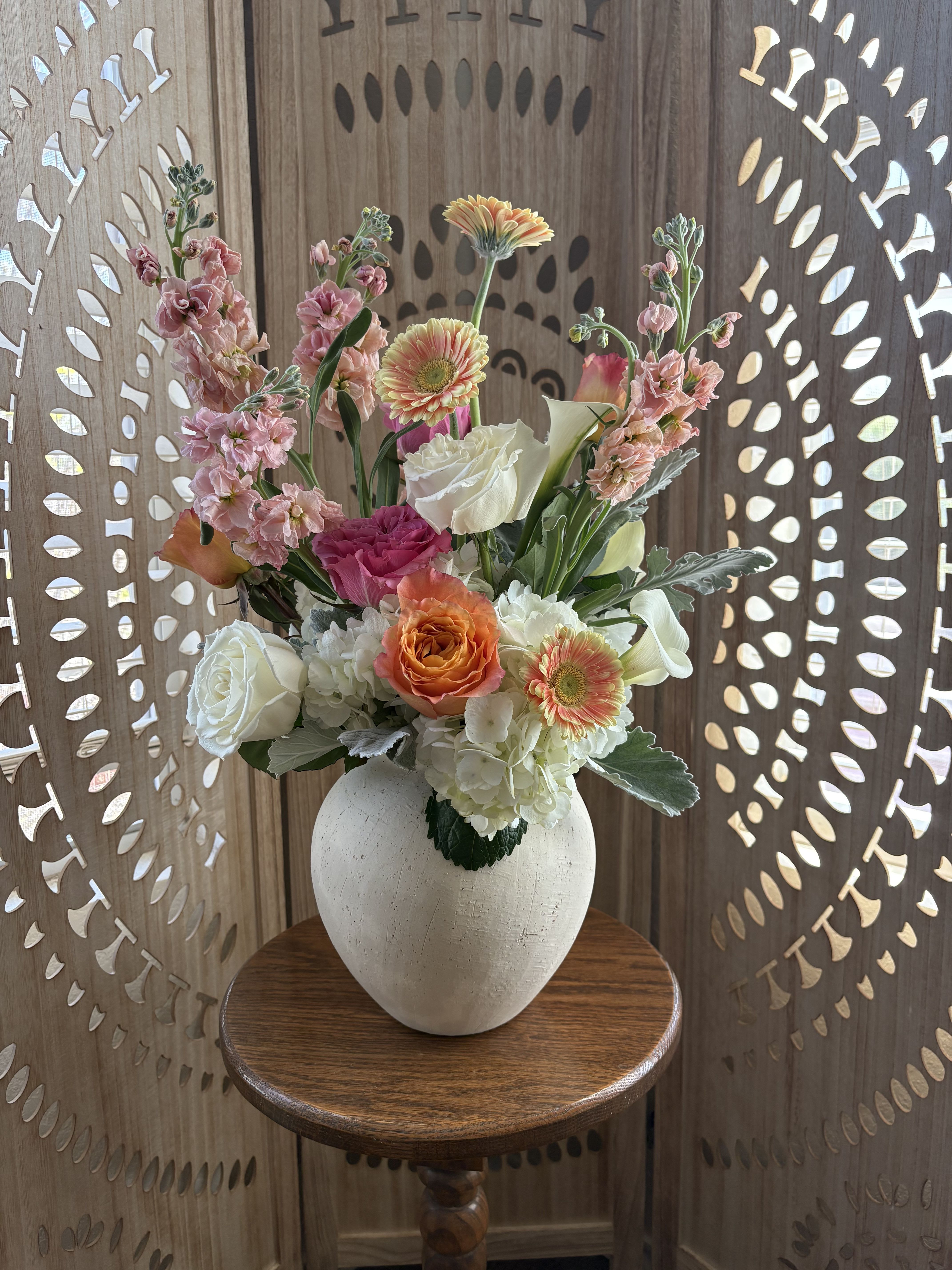 The Height of Romance - An elevated expression of soft, timeless beauty—The Height of Romance is designed to draw the eye upward with airy pastels and classic white blooms. Delicate layers of blush, cream, and whisper-soft tones create a cloud-like composition, while the tall, sculptural shape adds movement and grace.