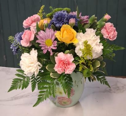 Watercolor Love - Watercolor Love is a soft and elegant Mother’s Day arrangement inspired by the delicate beauty of a painted spring garden. Designed with lush greenery and a lovely mix of fresh blooms in dreamy, blended hues, this piece feels like a watercolor masterpiece brought to life. Romantic, graceful, and full of charm, it’s a heartfelt way to celebrate the love and beauty of Mom this Mother’s Day.