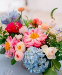 Mixed pastel bouquet with pink, blue, and cream flowers