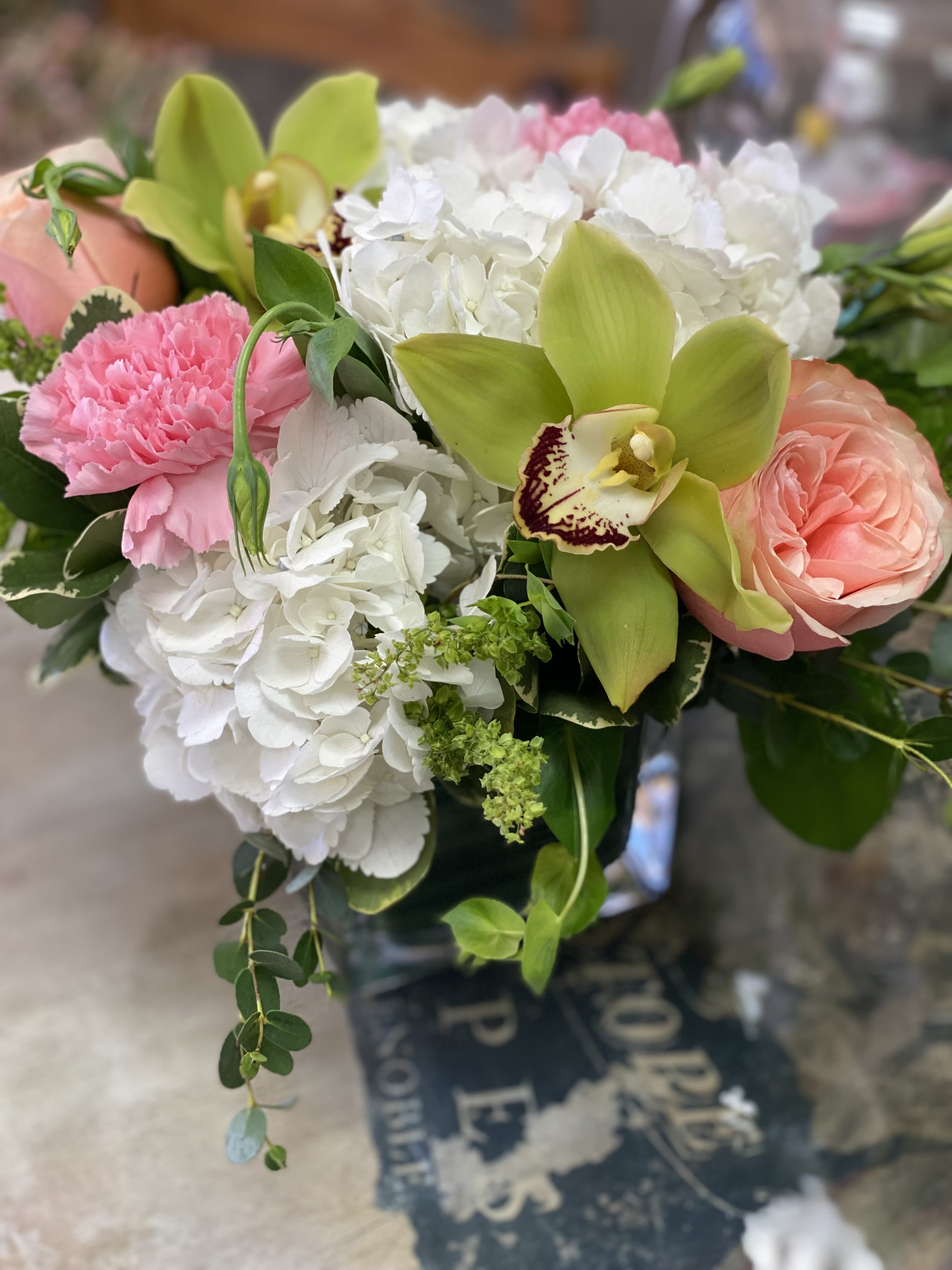 Smile - Hydrangeas, carnations, and roses in a cube with a cheerful garden feel