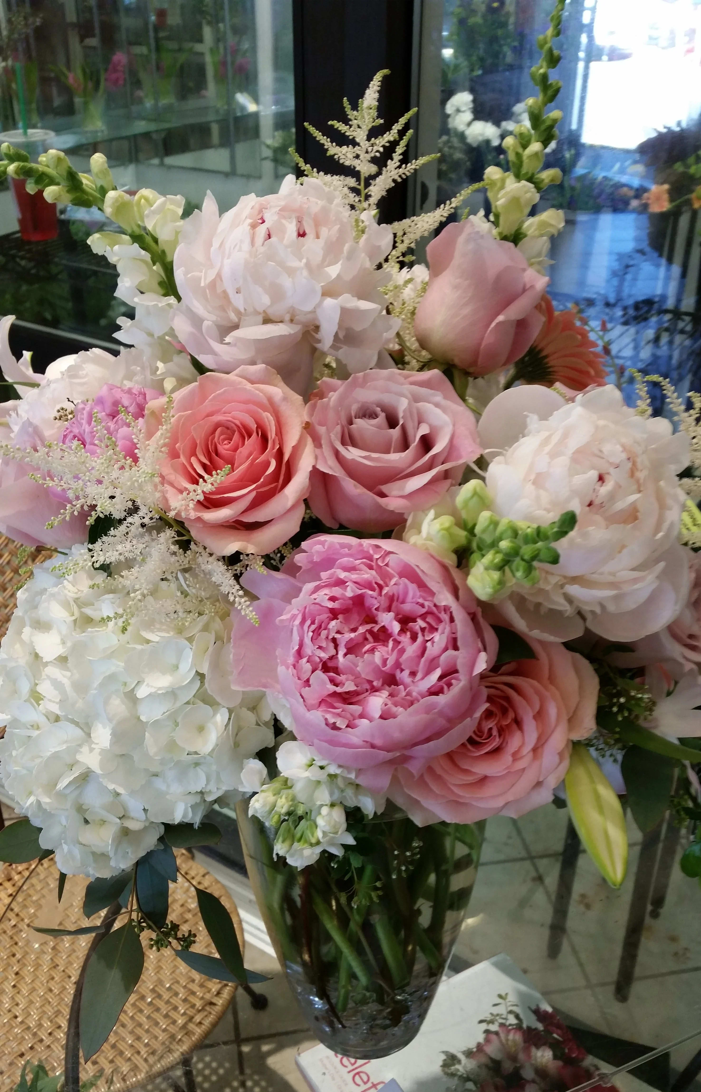 Pink and white mixed bouquet in a clear glass vase