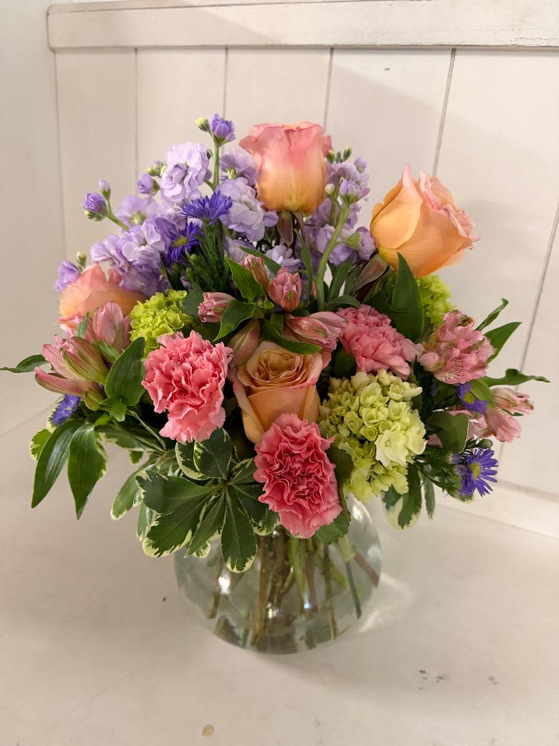 A MOTHER'S TOUCH - ROSIE POSIE VASE, FILLED WITH STOCK, ROSES, CARNATIONS, ALSTROEMERIA, HYDRANGEAS. PERFECT FLOWER ARRANGEMENT FOR THE MOM WHO DOES THE MOST FOR YOU.