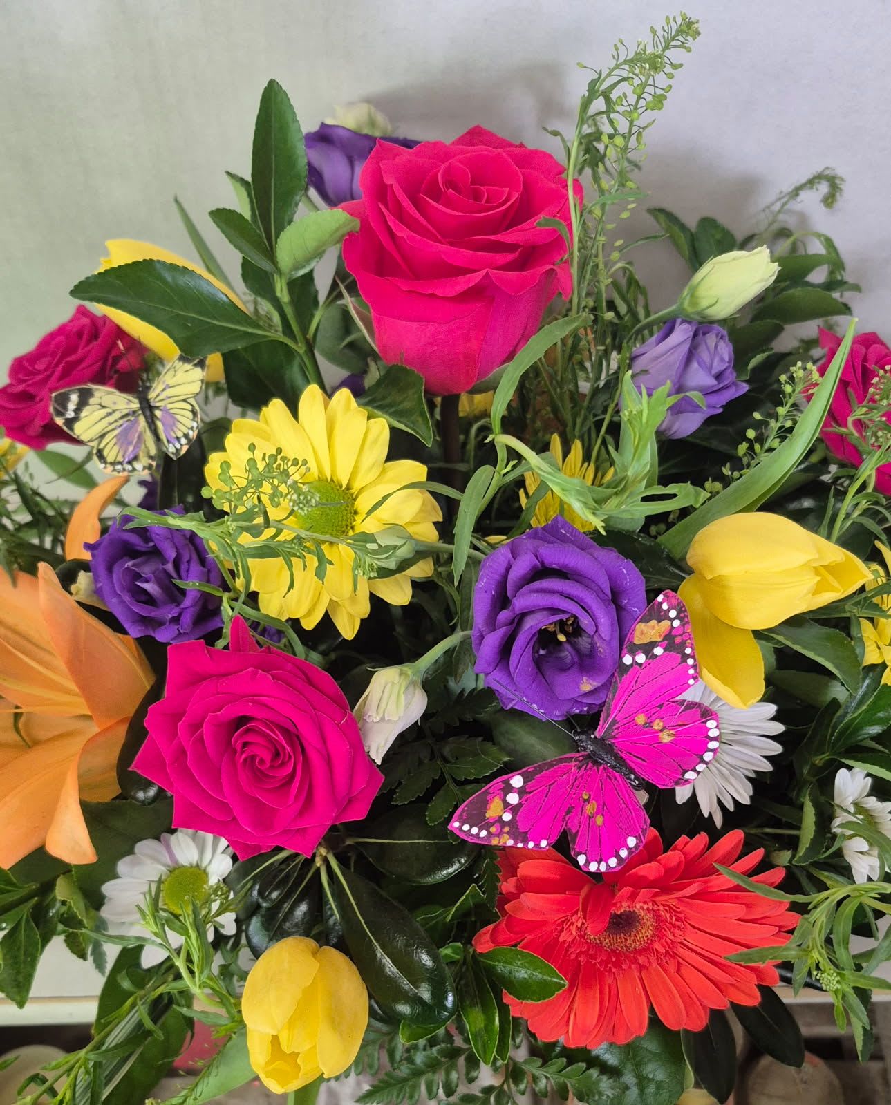 Colorful Centerpieces  - Beautiful mixed Flowers, Roses and More in a recycled fresh basil container