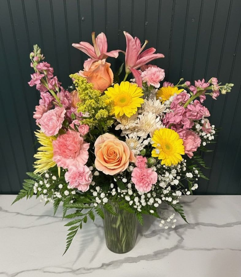 Designer Choice Mixed Vase - A soft, cheerful bouquet that brightens any spring celebration - this Designer Choice mixed vase is a mixed flower arrangement perfect for birthdays, thank-you gifts, or simply letting someone know you're thinking of them. Choose this vase when you want someone to feel celebrated without fuss - a thoughtful pick for moms, friends, coworkers, or hosts. Vase, water, and basic care are included; refresh water every 2-3 days, trim stems slightly when you do, and keep the arrangement out of direct sunlight to extend its life.