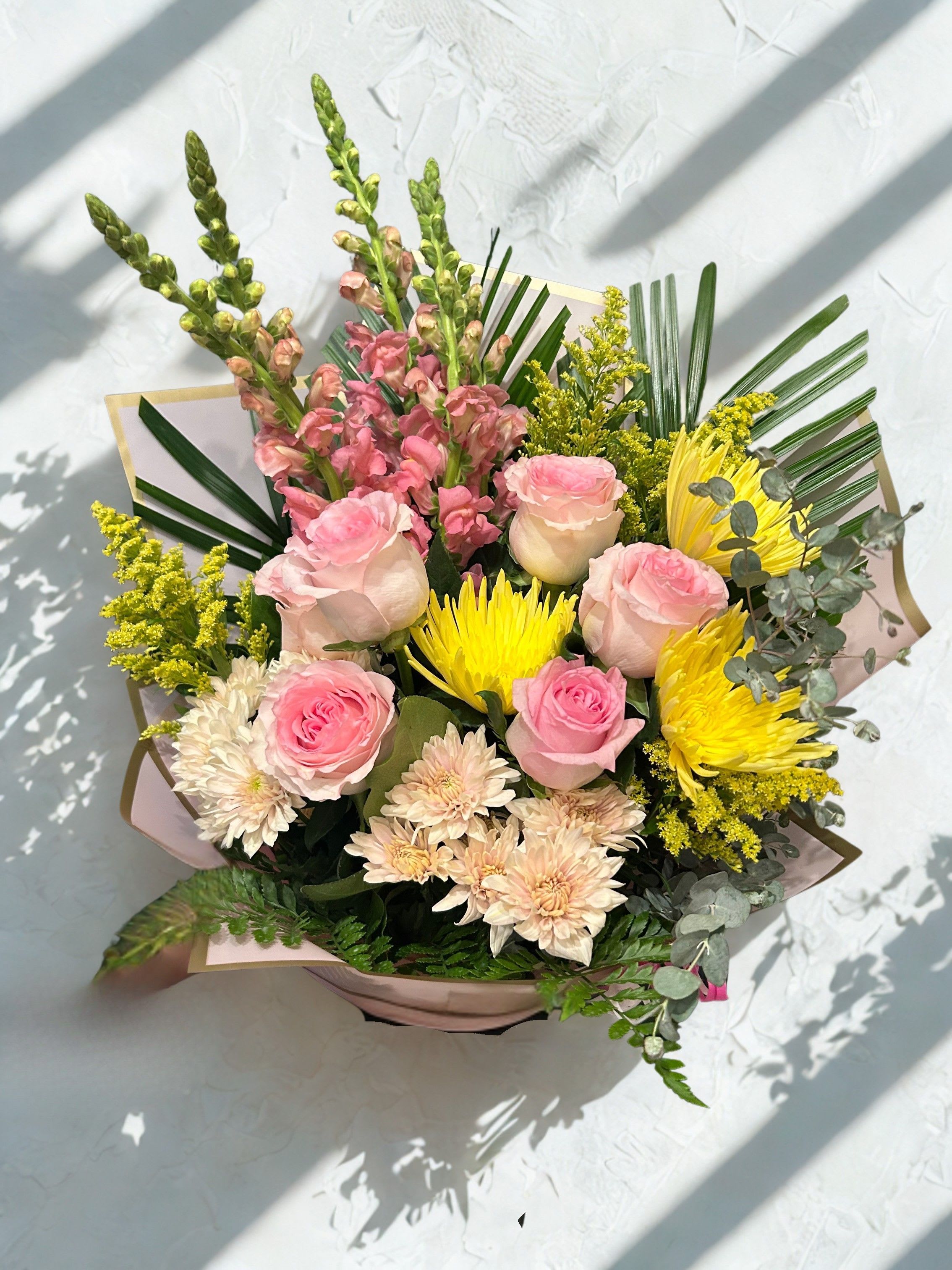 Mixed Seasonal Bouquet - This mixed seasonal bouquet is a lively, romantic presence-perfect as a birthday bouquet, thank-you arrangement, or cheerful "just because" gift.   Ideal for spring celebrations, everyday gifting, or brightening someone's day, this bouquet arrives ready to display-no vase required if placed in fresh water on arrival. To keep blooms looking their best, refresh the water daily and recut stems if you transfer to a vase.