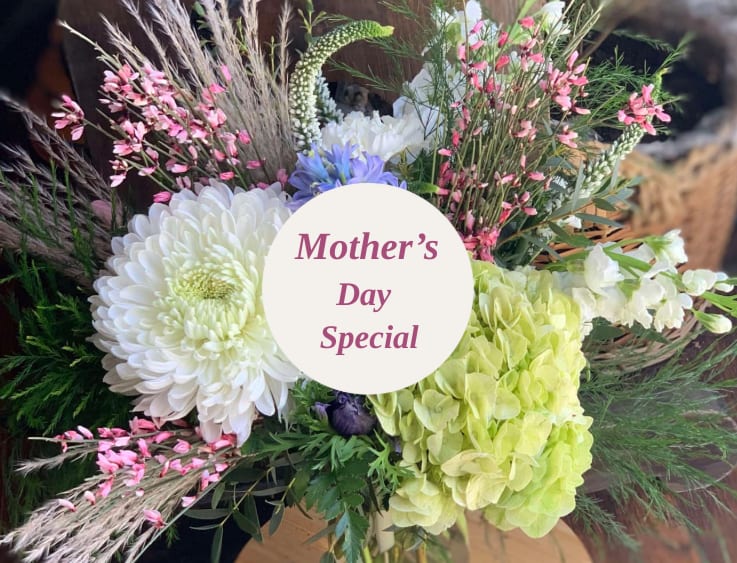 Mixed bouquet with white chrysanthemums, green hydrangea, and pink accents
