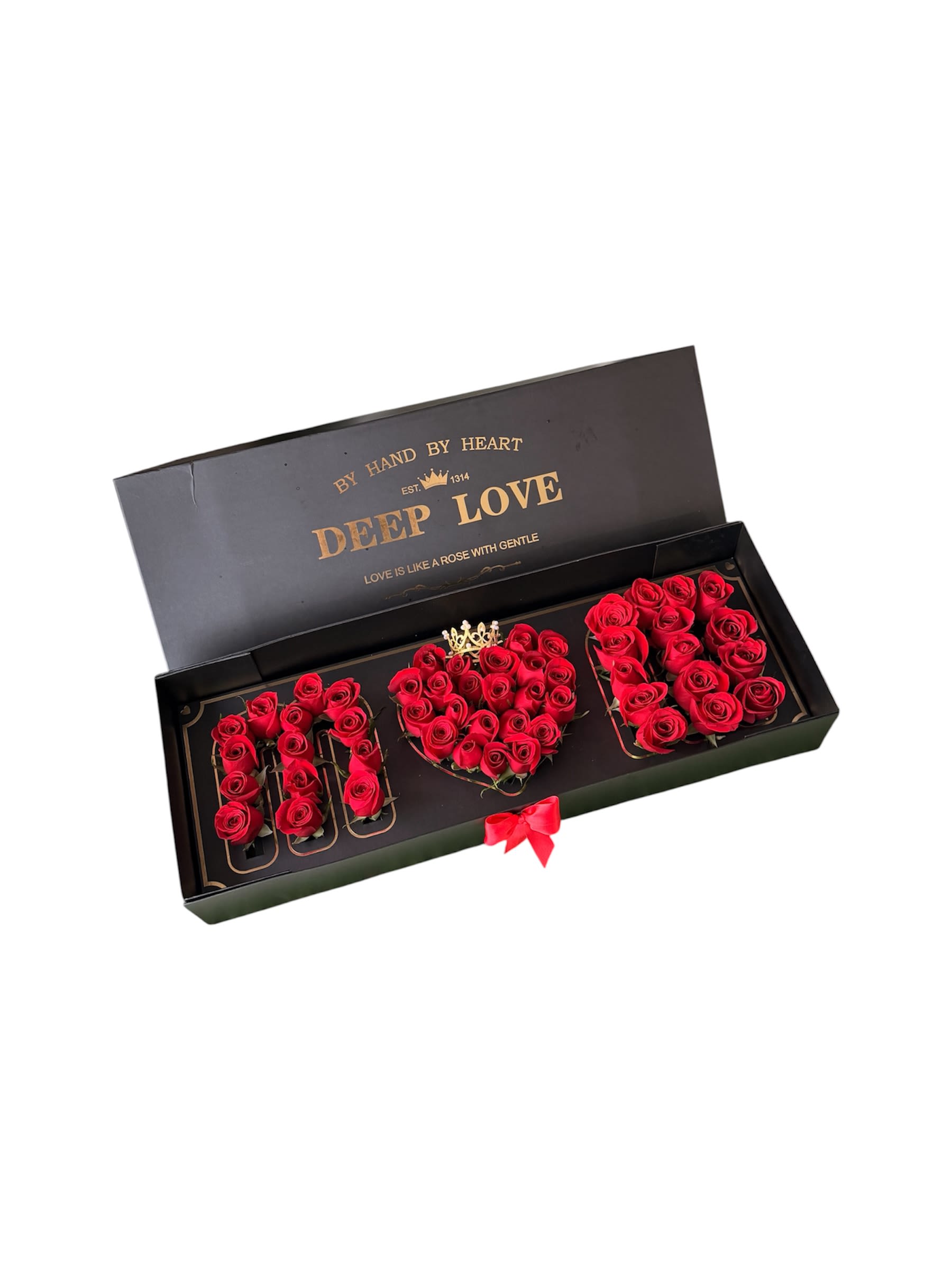 Mom Box  - A dramatic boxed rose arrangement that spells out "I LOVE YOU" with vivid red roses set against a sleek black presentation box - the perfect romantic gift for Mother's Day or any moment you want to declare your love. The bold contrast of deep black and crimson creates an immediate visual impact, and the tightly packed blooms form a crisp, readable message that will make the person you're thinking of feel truly treasured.  Each letter is formed from freshly cut red roses nestled in a low black gift box finished with a red ribbon bow along the front edge. A small decorative crown accent near the center adds a touch of whimsy and keeps the look feeling special and celebratory. This design is ideal for anniversaries, romantic surprises, or a standout Mother's Day present; the compact box is easy to display on a dresser or table and keeps the arrangement looking neat and intentional.