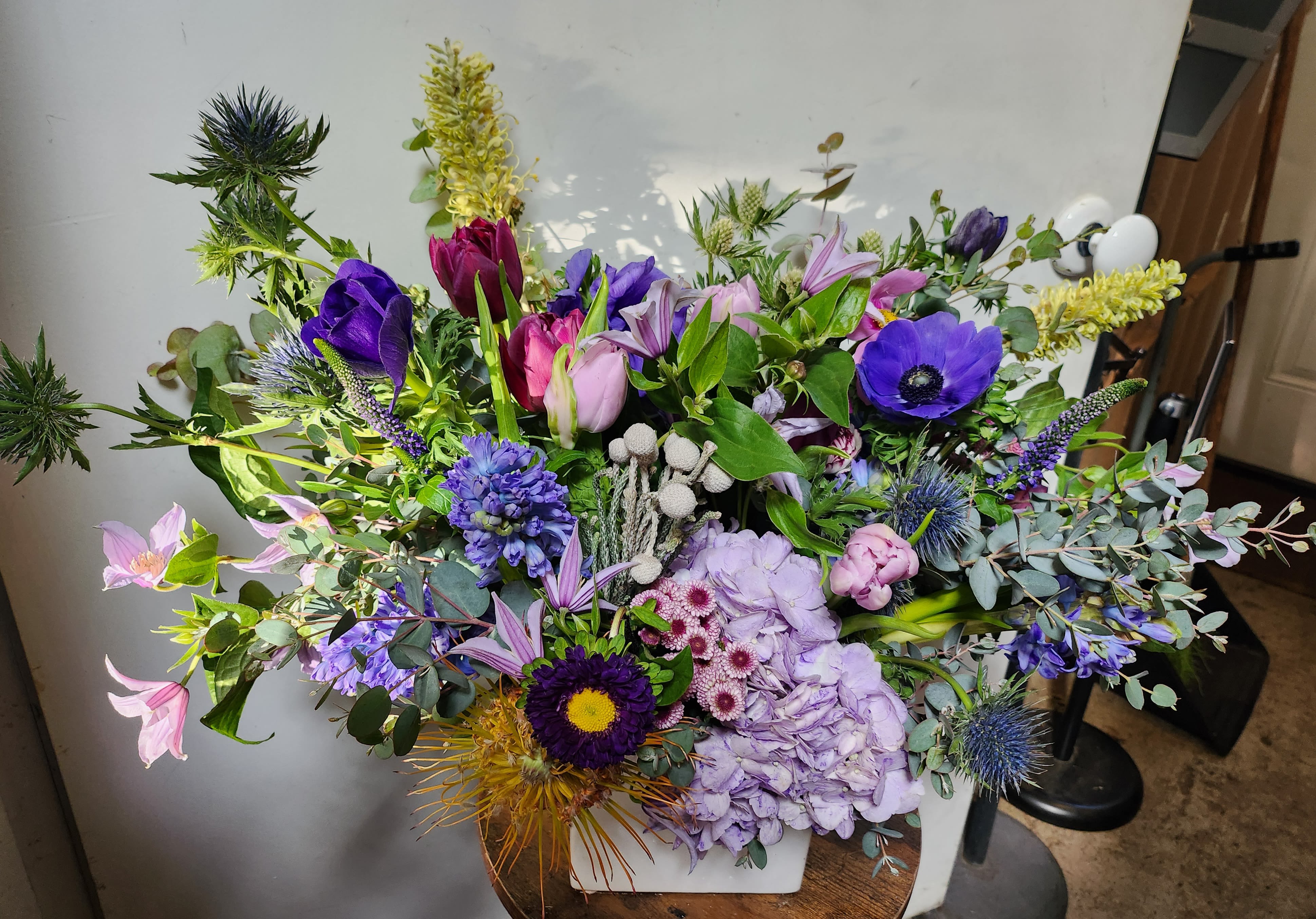 Large mixed bouquet with purple, pink, and yellow flowers